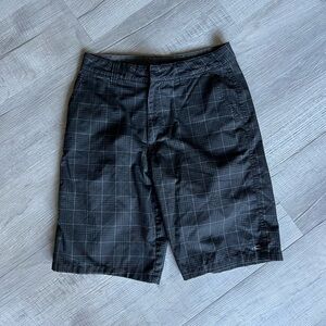 O’Neill size 30 black plaid white strip shorts